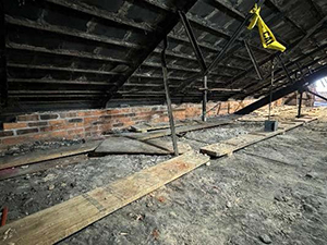 Attic masonry knee wall on west side in the Perry County Courthouse.