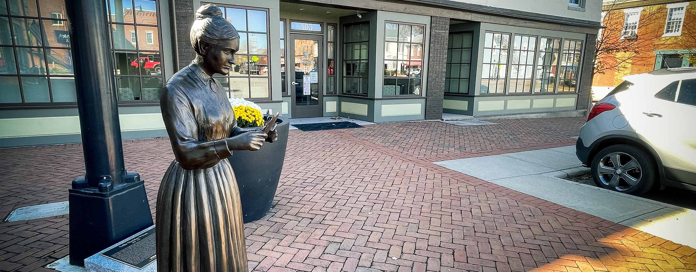 Statue of Nellie Sheridan Wilson, Somerset, Ohio's first female postmaster, on town square in Perry County.