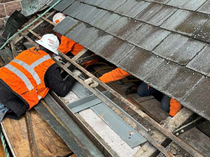 Workers installing steel on the north attic wall during renovation of the Perry County Courthouse.