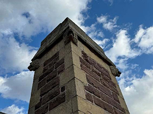 View of ornamental animal head on turret at the Perry County Courthouse.