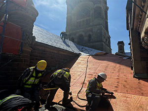 Workers applying roof sheathing during the Perry County Courthouse renovation.