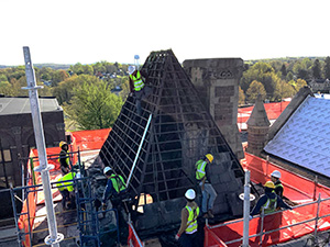 Workers applying roofing on the east tower of the Perry County Courthouse.